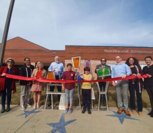 Ribbon cutting. "Unity" by Nathan Pierce. Located at Northwood Elementary. Sponsored by Northwood Foundation.